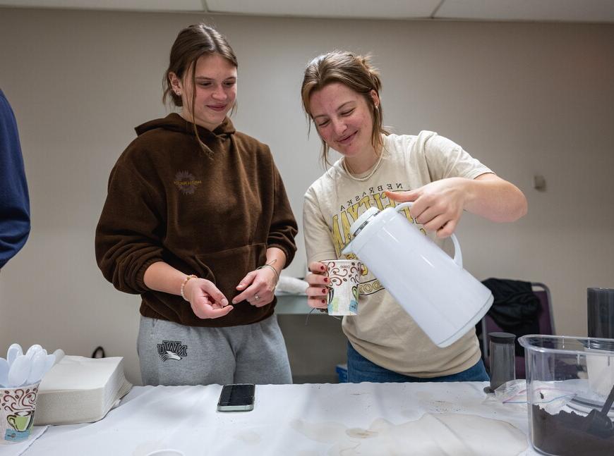 NWU students pour a cup of coffee.